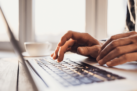 Image-4-1 » Advent Trinity Marketing Agency user typing on a laptop